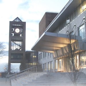 Photograph of the library clock tower and Powerdermaker Hall at dusk.